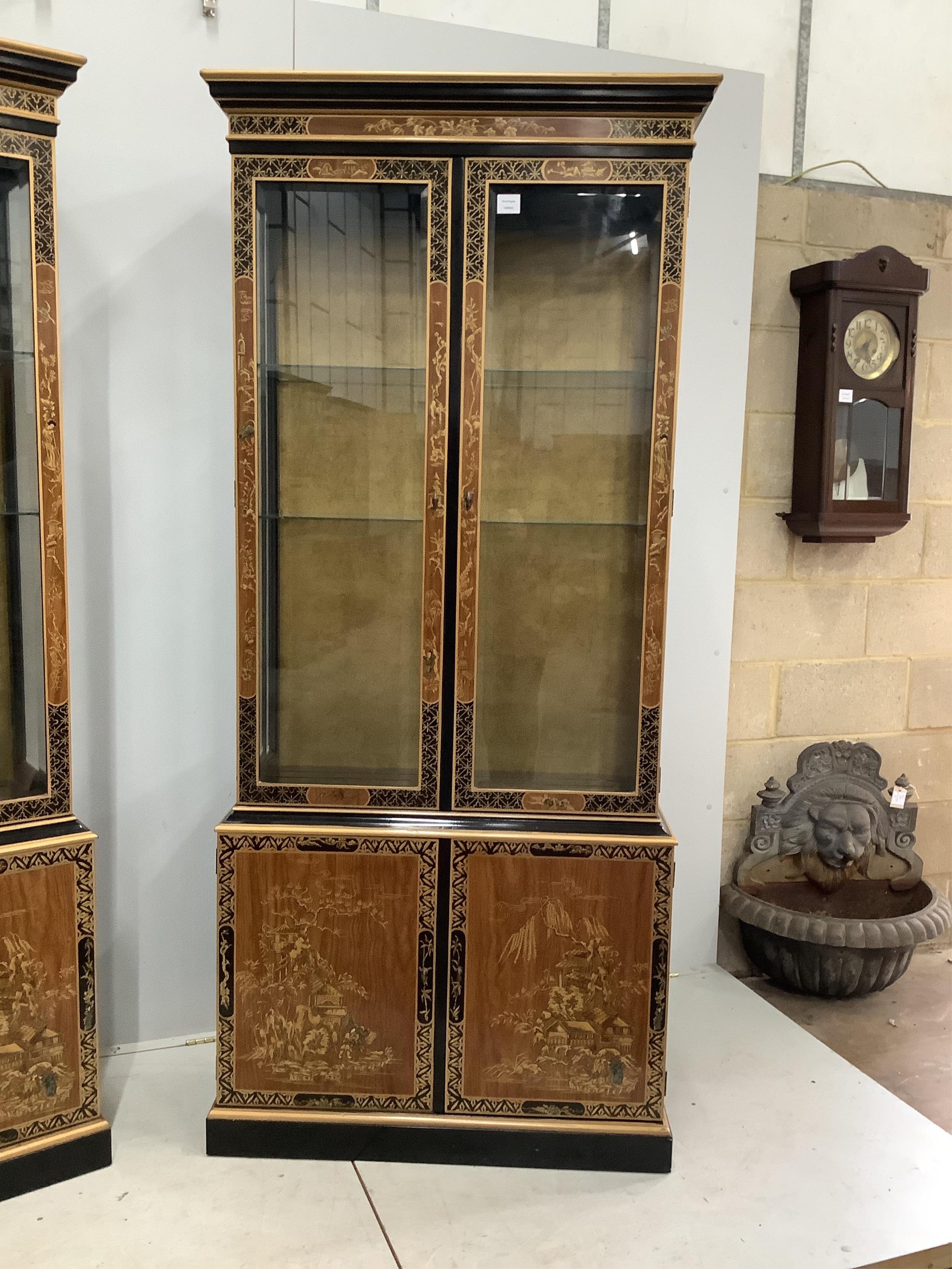 A pair of modern chinoiserie lacquered display cabinets, width 90cm, height 204cm. Condition - good